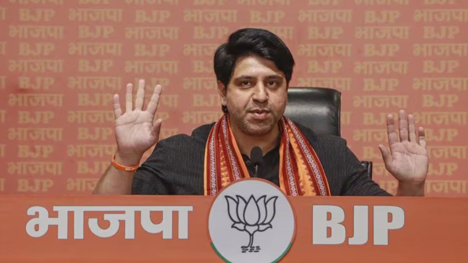 BJP-NEW DELHI a man standing speaking something, he is for sure a member of bjp